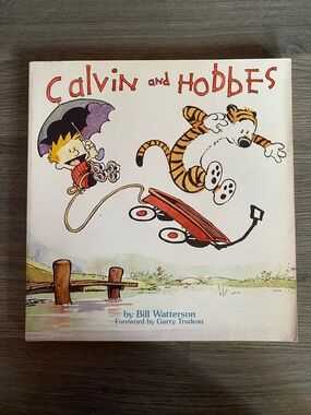 Calvin and Hobbes Paperback Book - White Cover with Red Title
